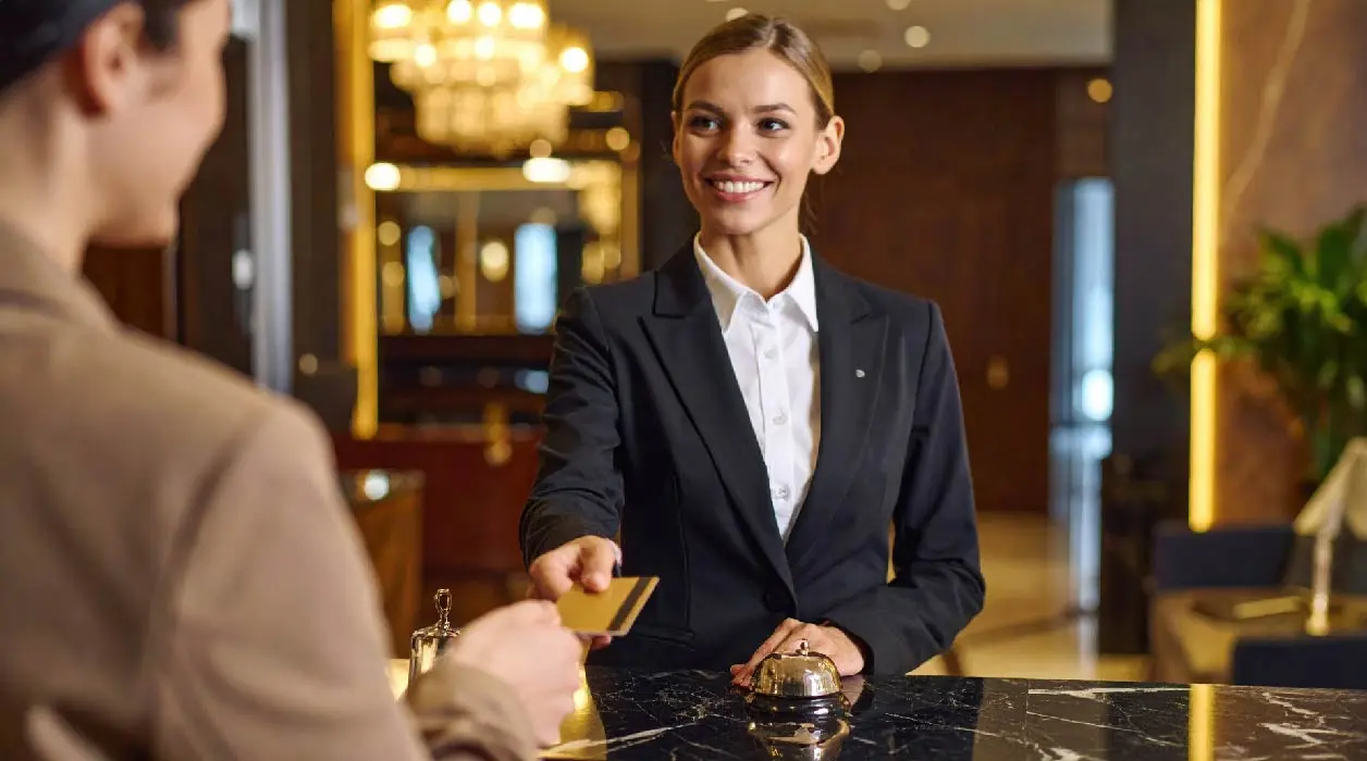 a-woman-in-a-business-suit-is-handing-a-credit-card-01